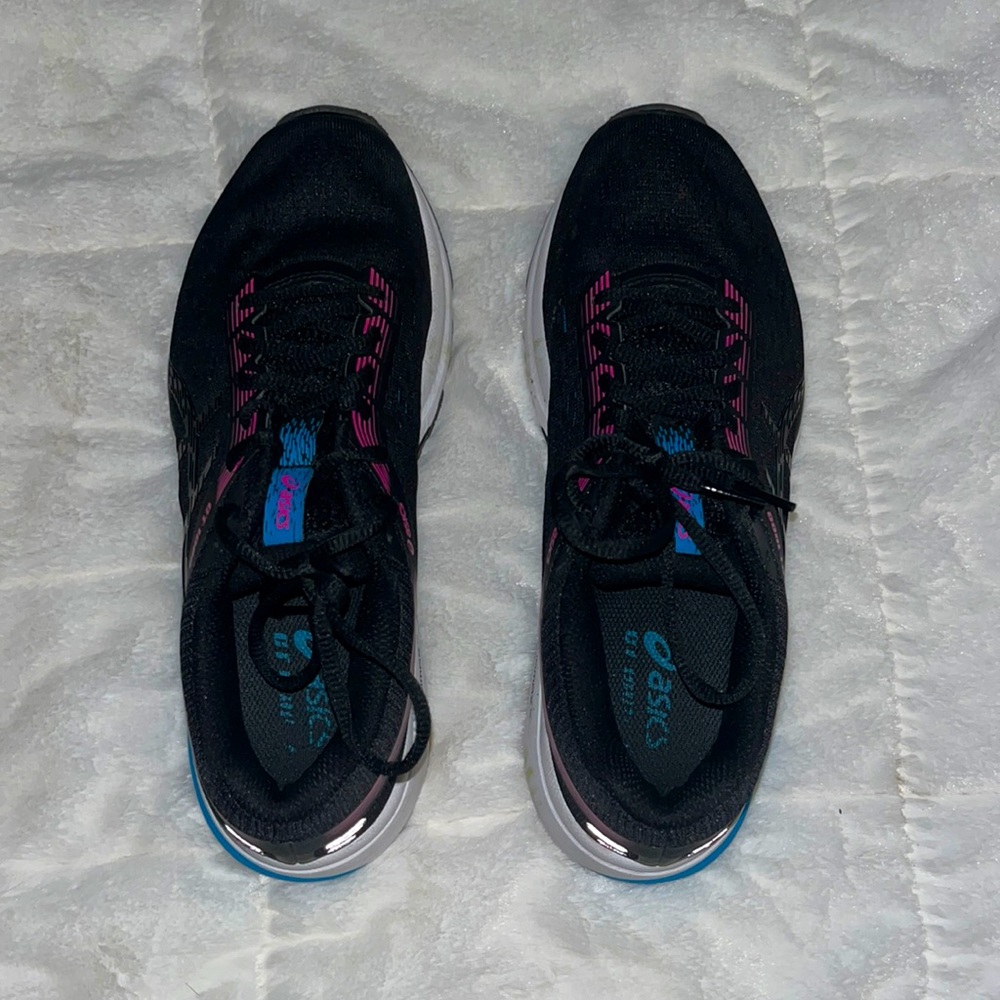 never worn, size 8, mostly black with hot pink and neon blue hints